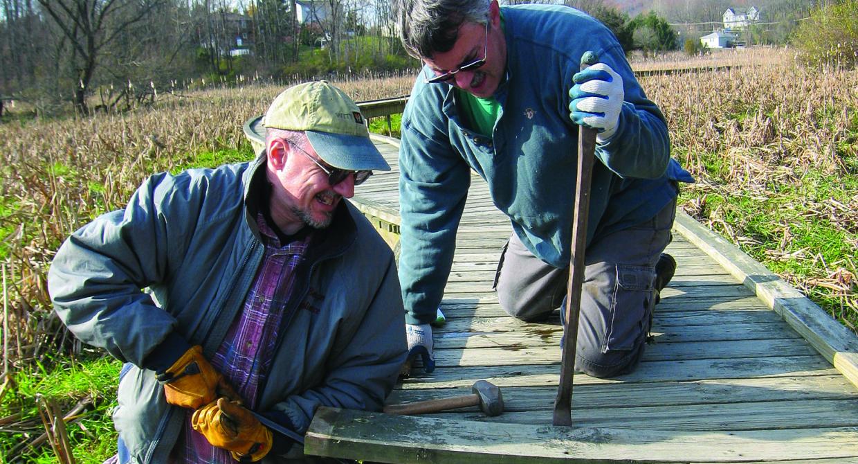 West Jersey Crew Chief David Day and crew member Pete Zuroff work on repairing old decking on the Pochuck Boardwalk. Photo by Georgette Weir.